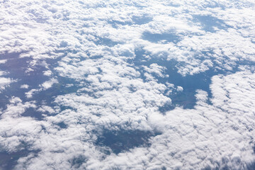 Cumulus white clouds view from above