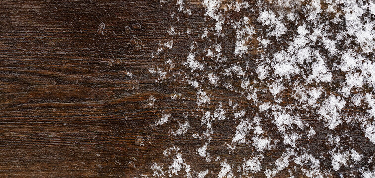 ice crates and snowflakes lie on a wooden,abstract background,grunge background with space,art background for design with cooy space,