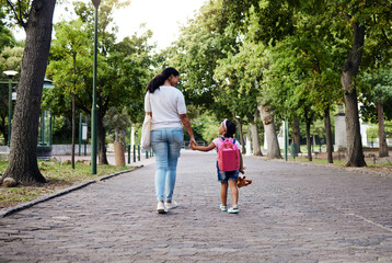 Walking, park and mother holding hands with girl on journey for back to school, learning and class for first day. Love, black family and mom with child walk for kindergarten, education and play date