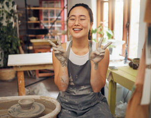 Pottery, peace and clay hands portrait of woman in workshop for small business art class. Asian...