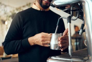 Hands, barista and brewing coffee in kitchen using machine for hot beverage, caffeine or steam....