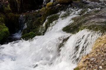 scene of winter stream flowing vigorously