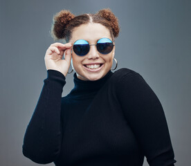 Fashion, smile and woman with sunglasses for beauty cosmetics, makeup and luxury style in studio. Aesthetic, designer brand and confident girl with stylish accessories, trendy and edgy jewellery