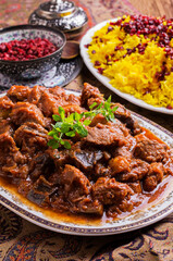 Traditional Persion lamb ragout xoresht-e badenjan with vegetable served with steamed saffron rice...