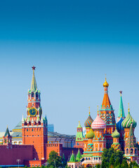 Spasskaya Tower of Moscow Kremlin and Cathedral of Vasily the Blessed (Saint Basil's Cathedral) on Red Square in sunny summer day.  Moscow. Russia