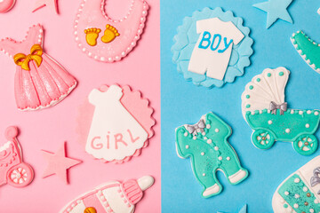 Boy or girl.A set of delicious baby shower cookies on a colorful background. Gender cookies.Baby shower party. Close-up. Flat lay. Place for text.