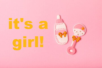Set of delicious baby shower cookies on a pink textured background. Gender cookies.Baby shower...
