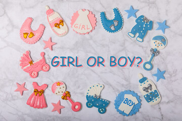 Boy or girl.A set of delicious baby shower cookies on a colorful background. Gender cookies.Baby...
