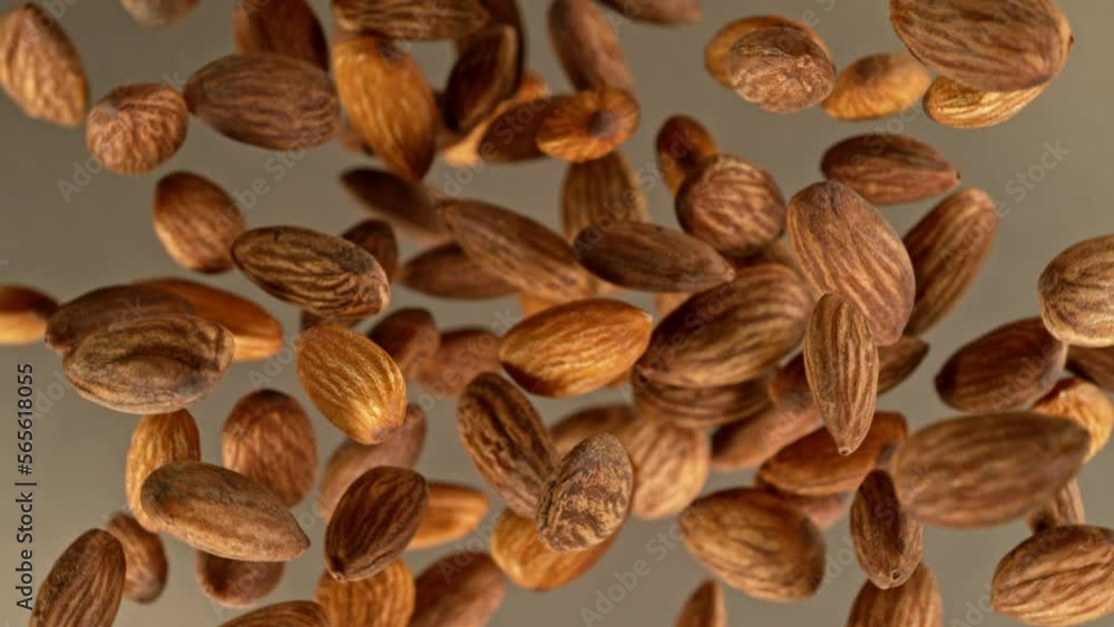 Poster super slow motion of rotating almonds up to the air. filmed on high speed cinema camera, 1000fps, pl