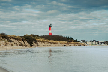 lighthouse on the shore of the ocean
