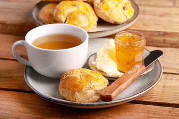 Homemade scones served with butter and marmalade