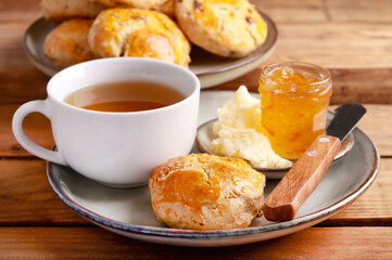 Homemade scones served with butter and marmalade
