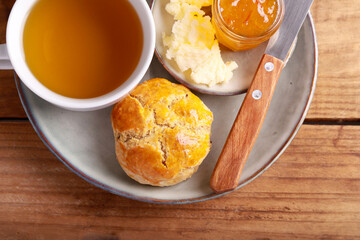 Homemade scones served with butter and marmalade