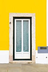 Typical vintage portuguese facade with white window