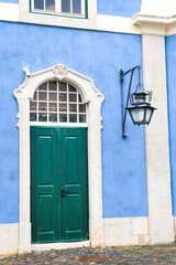 Fototapeta na wymiar Typical vintage portuguese facade with white windows