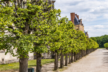 Beautiful Public Park near Palace of Fontainebleau (Chateau de Fontainebleau, 1137) - one of largest old French royal chateaux in suburban of Paris (55 kilometres). Fontainebleau, France.