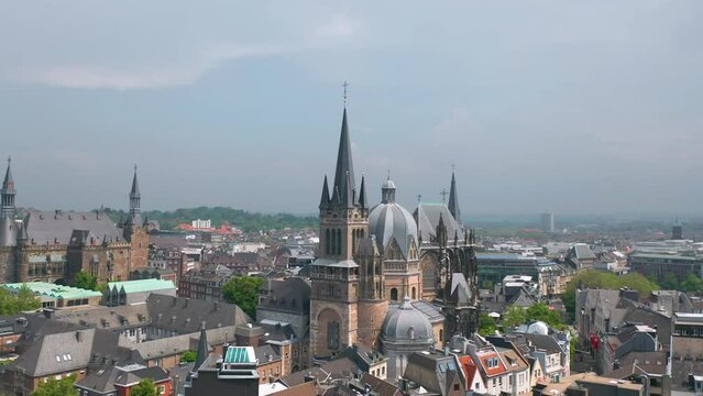 Aachen (Germany) skyline summer panorama. Aerial view of Aachen Cathedral (German: Aachener Dom) with Katschhof square and Town Hall (Rathaus) in background