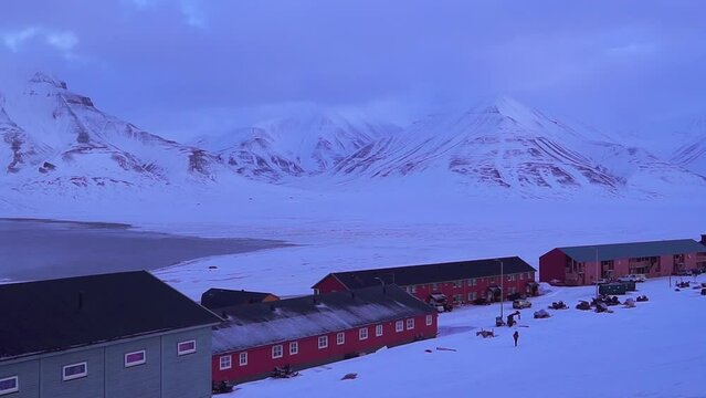 Longyearbyen, Spitsbergen, Small town among snow-capped mountains of the Norwegian archipelago of Svalbard Row of colourful chalet houses in Longyearbyen. High quality FullHD footage