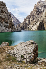 Rock formation around the alpine Köl-Suu lake, Kurumduk valley, Naryn province, Kyrgyzstan