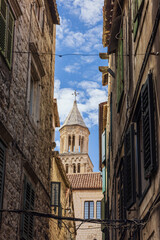 A narrow alley in Diocletian's Palace in Split with the cathedral in the background