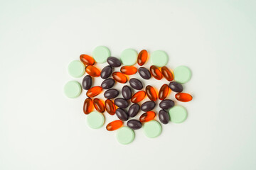 Many different tablet pills on white background, flat lay, with copy space.