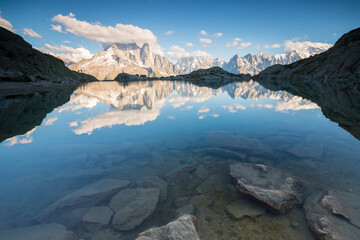 The reflection of the Mont Blanc massif in the clear waters of Lake Blanc, Chamonix-Mont-Blanc, Haute-Savoie, France