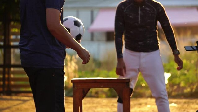 Footage Slow Motion: People play teqball on the park