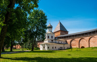 Veliky Novgorod, Russia. Church of the Intercession of the Holy Virgin adjacents to the eastern facade of the Novgorod Kremlin wall and Pokrovskaya tower.