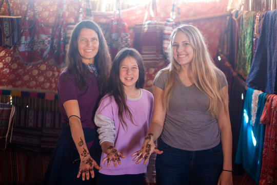 women getting henna in a bedouin tent