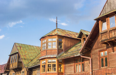 Traditional wooden architecture in the center of historic village Zakopane, Poland - obrazy, fototapety, plakaty