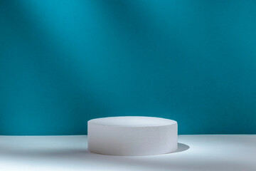 Podium 3D on a blue abstract background to show the product from copy space. High quality photo