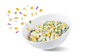 Fototapeta na wymiar Cucumber corn salad in a bowl on a white isolated background