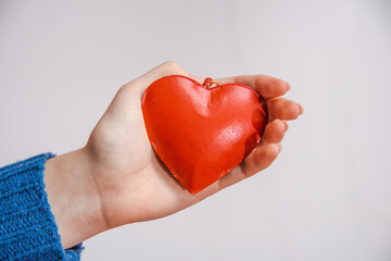 Woman holding red heart, health ,  world heart day, self care , healthy lifestyle concept