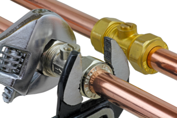 wrenches being used to adjust a compression isolating valve, png transparent.	
