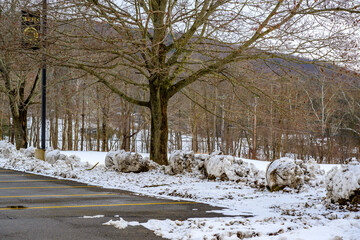 Snow is pushed to the edge of the parking lot at Windsor High School in Upstate NY.  The parking...