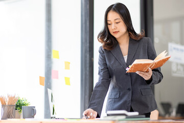 Business Documents, Auditor business Asian woman checking searching document legal prepare paperwork or report for analysis TAX time,accountant Documents data contract partner deal in workplace office
