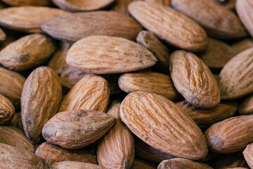 Almond nuts close. Background of almond nuts. Pile of almonds cl