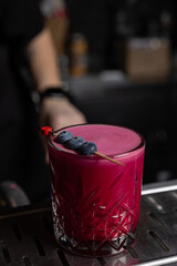 the bartender prepares a delicious alcoholic cocktail	