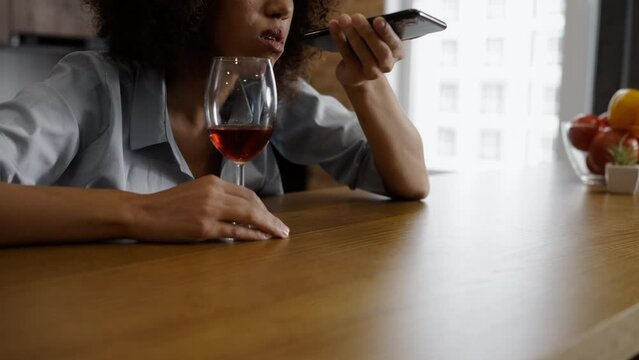 Close-up of young drunk woman calling her ex, life crisis, alcohol dependence