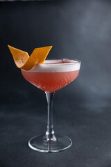 the bartender prepares a delicious alcoholic cocktail	