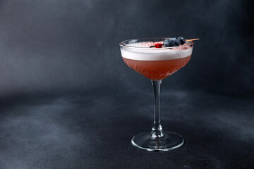 the bartender prepares a delicious alcoholic cocktail	