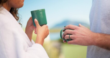 Couple, tea and people drinking coffee in the morning on vacation or holiday at a hotel or on the balcony. Lovers, man and woman holding hot beverage in a cup talking and enjoying quality time