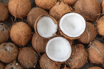 piece of coconut for made virgin oil cold pressed. Virgin coconut oil liquid clear pure by cold pressed with HDL by Raw coconut milk  regular saturated fat good cholesterol in Virgin coconut oil  - obrazy, fototapety, plakaty