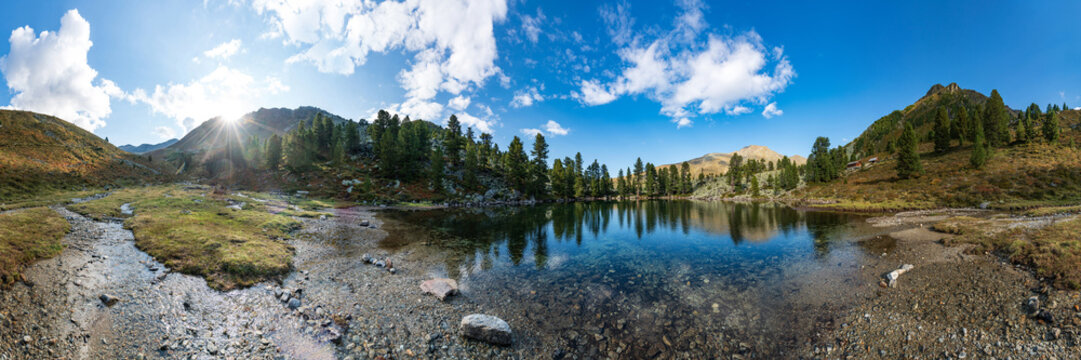 Mountains, peaks, lake, everlasting ice and trees landscape. Knapenweg natural environment. Hiking in the alps, Tirol, Austria, Europe