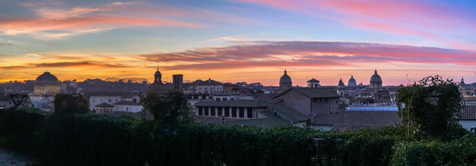 Night view at St. Peter's cathedral in Rome with reflection on Tiber river