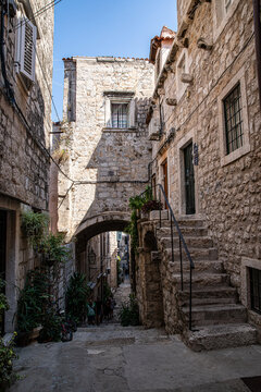 Fototapeta Morning on narrow street of Mediterranean town.