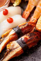 Eel sushi and squid sushi on a plate