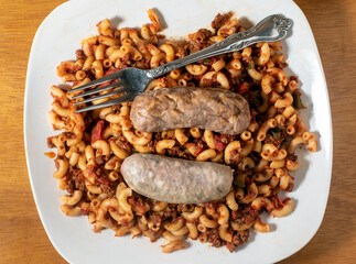  american chop suey top with  two italian sausages,