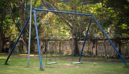 Children blue swing in the park