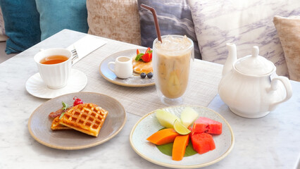 Hotel breakfast includes refreshing iced coffee, colorful fresh fruits